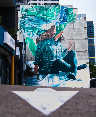 A vibrant mural adorning the walls of Fish Lane, full of color and creativity.