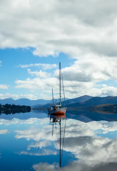 A peaceful scene of the Huon River flowing through Franklin, surrounded by nature.
