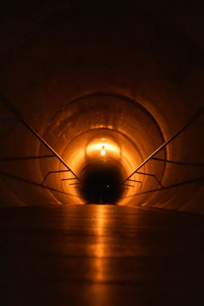 A mysterious tunnel within the Museum of Old and New Art, evoking curiosity.