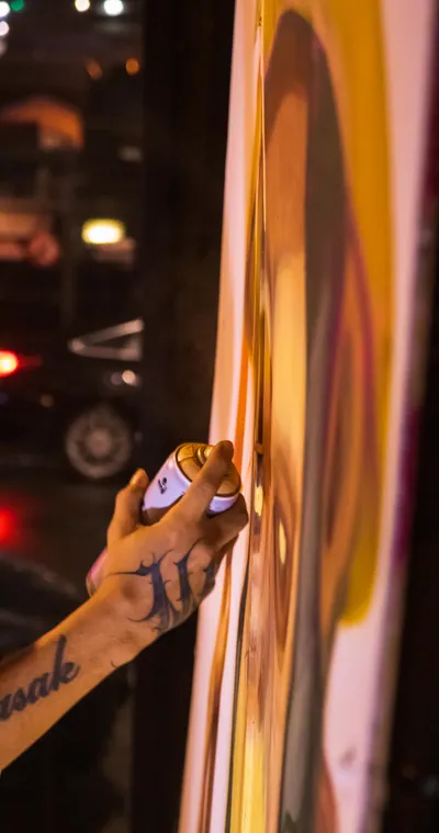 An energetic moment from a Paint and Slam event, blending art and performance.