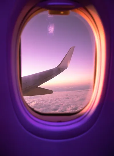 A dynamic shot of a plane soaring through the sky.