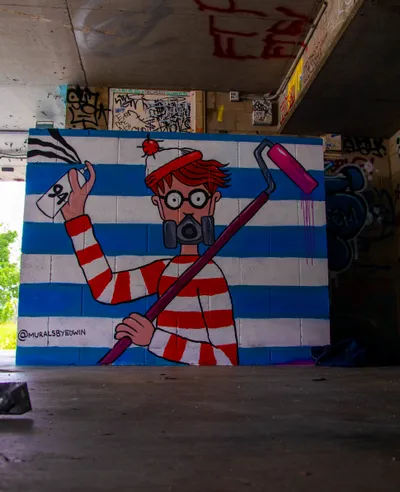 A playful 'Where's Wally' themed mural created by artist Edwin.